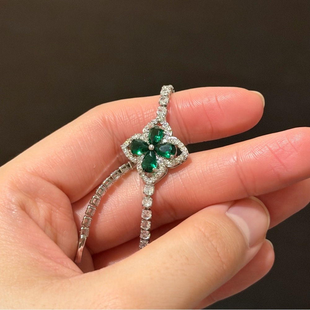 Simulated diamond tennis bracelet w green simulated clover | Never worn